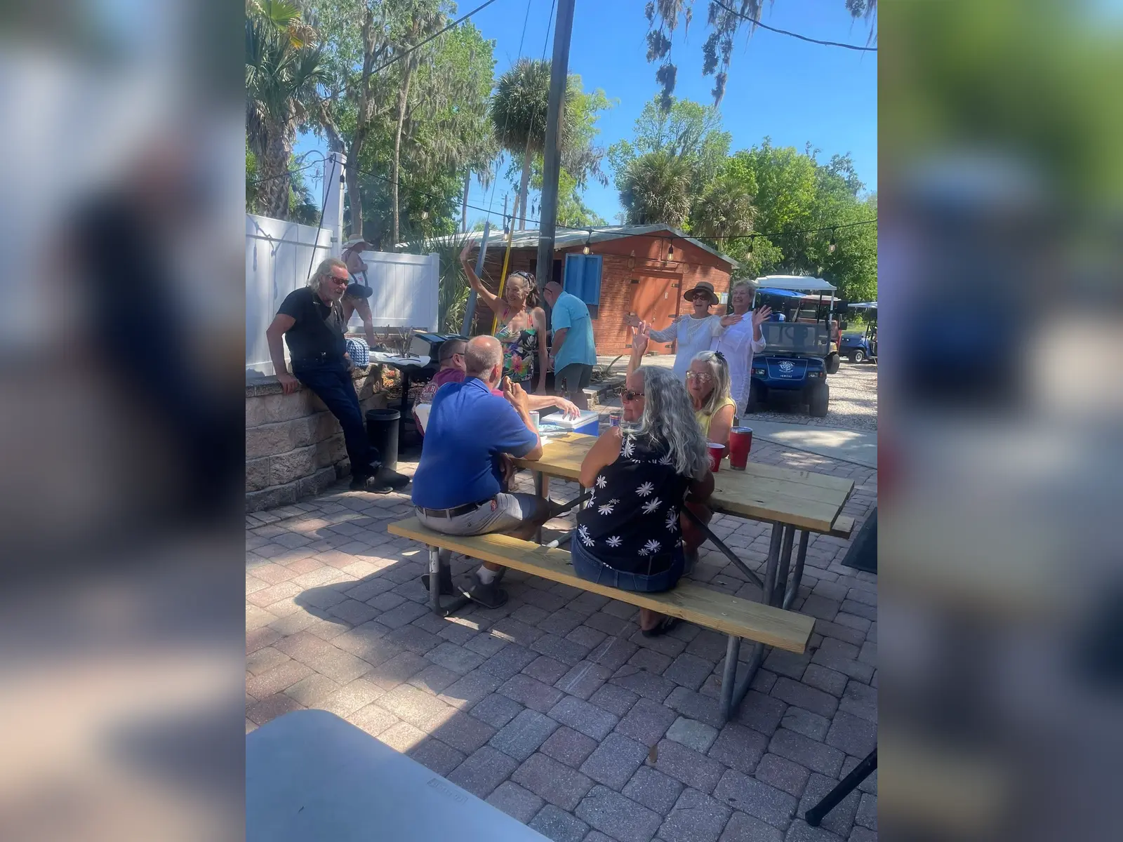 Guests enjoying an outdoor social gathering at Endless Summer Campground