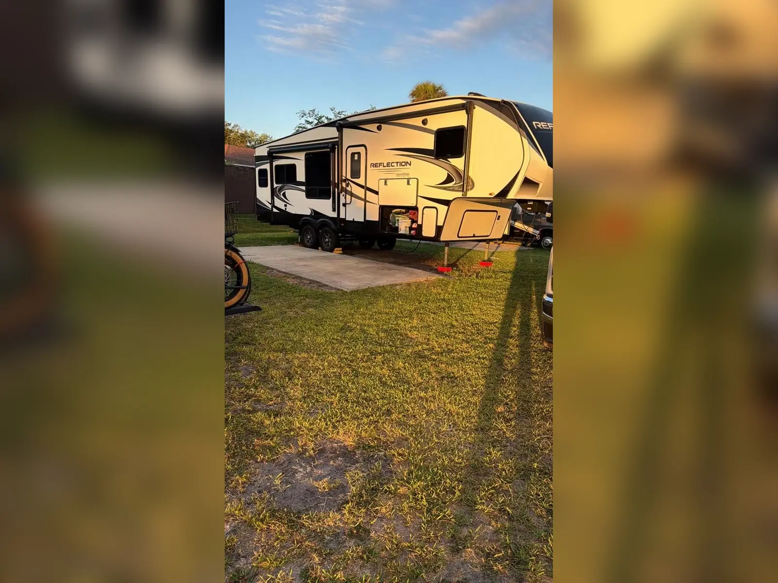 Large fifth-wheel RV on a campground site in Port Orange Florida